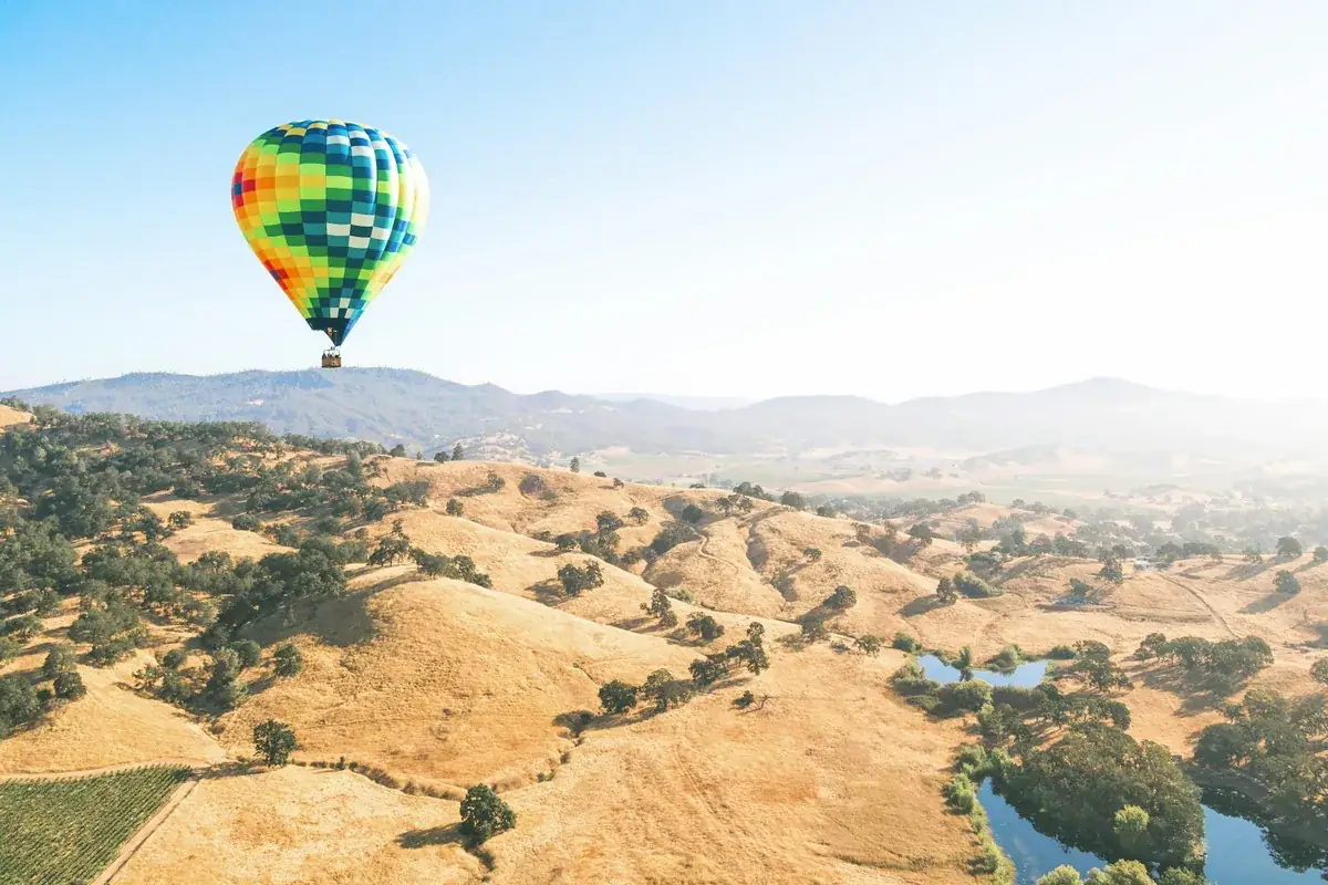 A hot-air balloon above the hills and vineyards of Napa Valley
